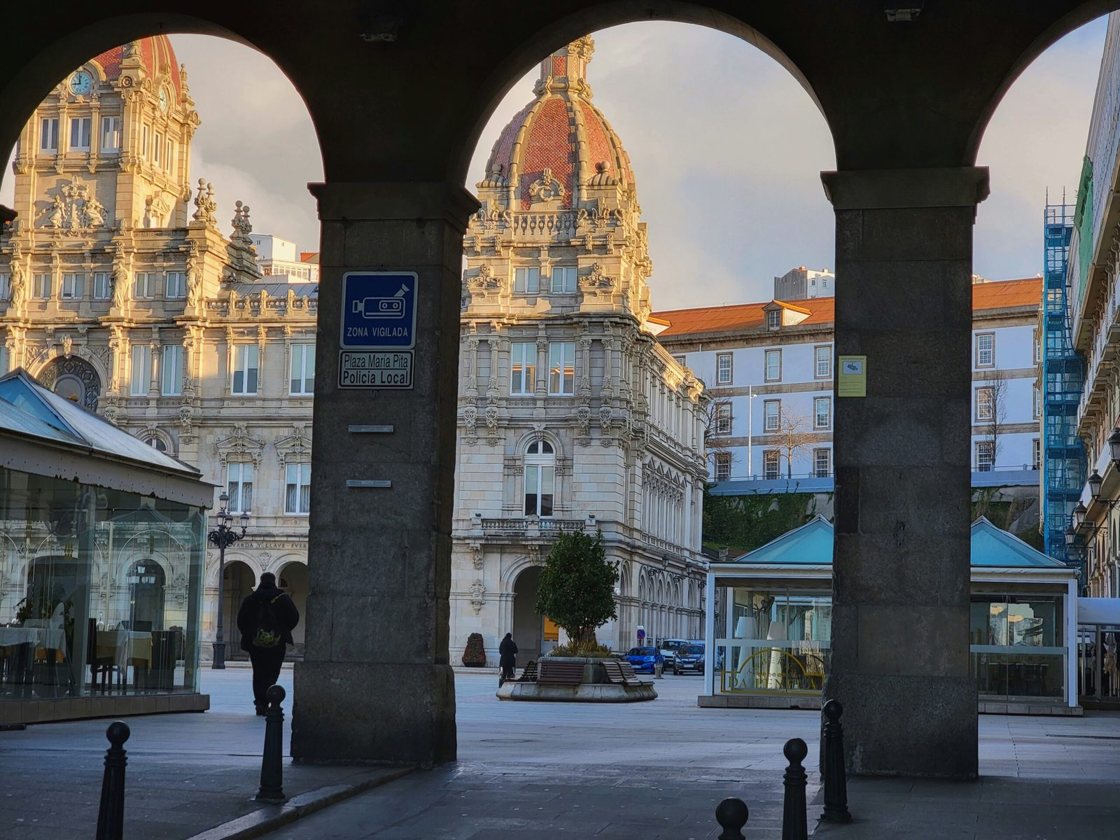 a couple of people that are standing in front of some buildings