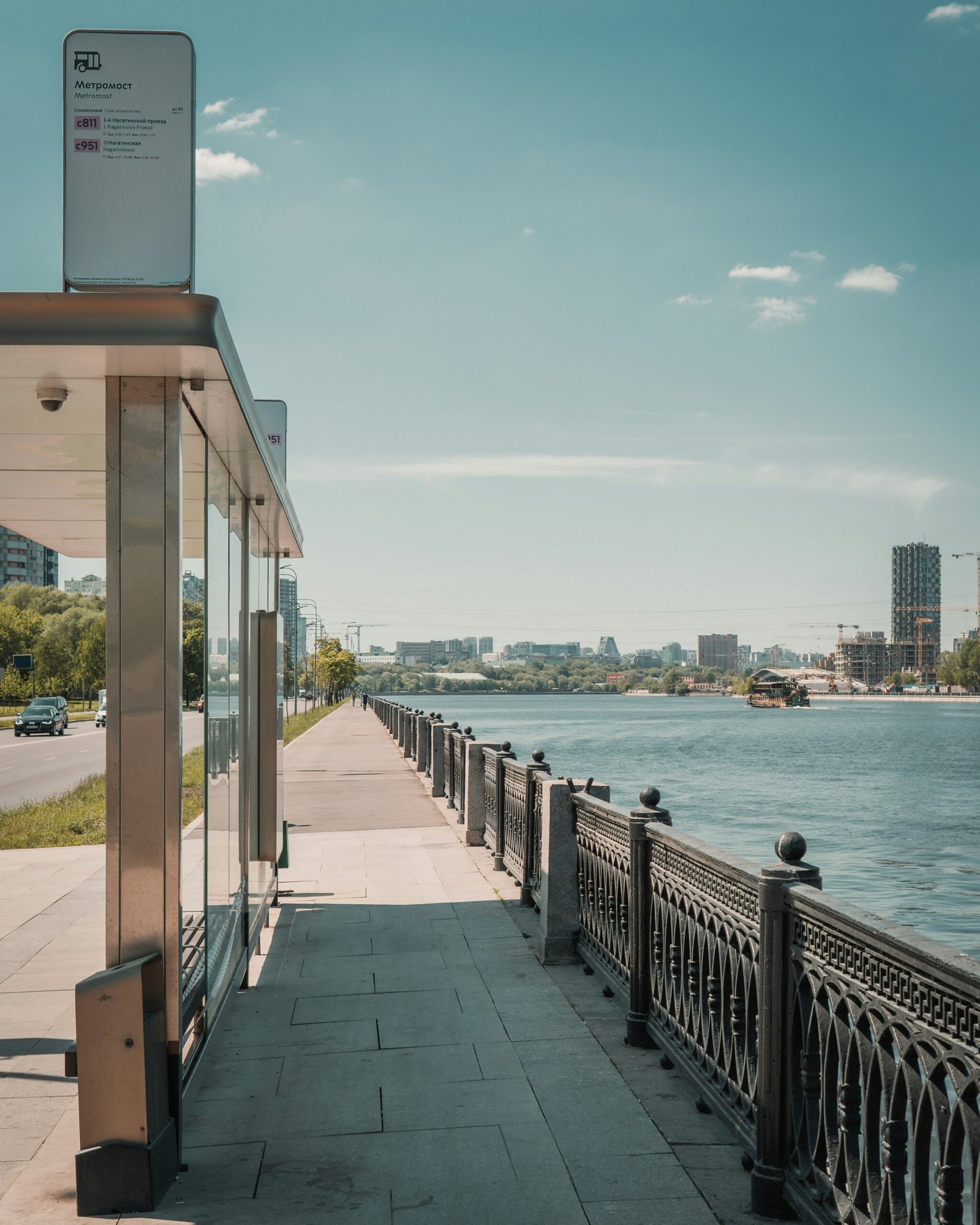 a walkway next to a body of water